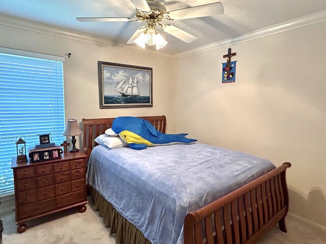 bedroom with light carpet, ceiling fan, and crown molding