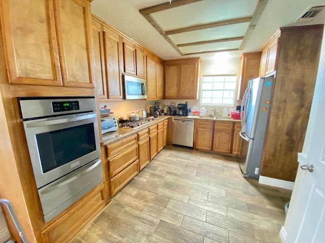 kitchen featuring sink and appliances with stainless steel finishes