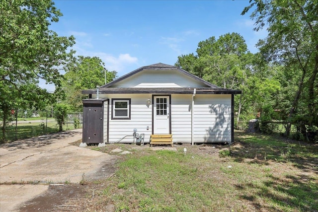 rear view of house with entry steps