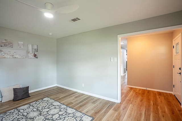 empty room featuring light hardwood / wood-style floors and ceiling fan