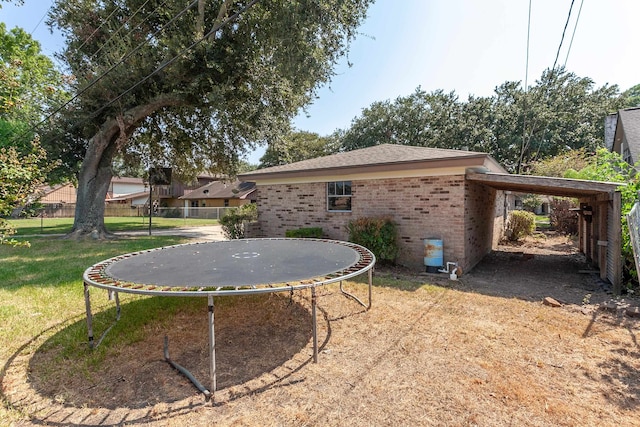 view of yard with a trampoline