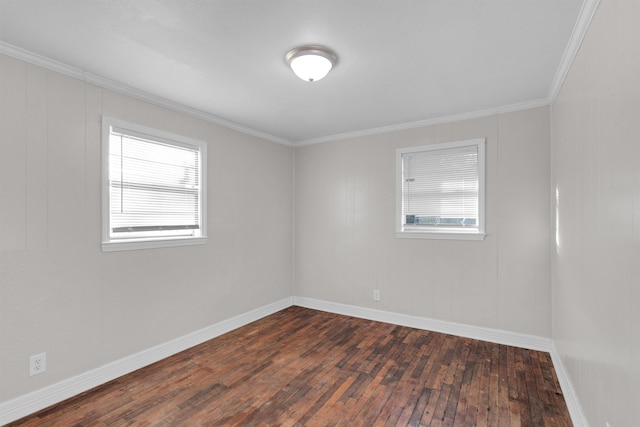 empty room with dark wood-type flooring and ornamental molding