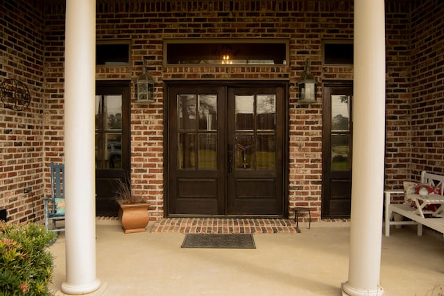 entrance to property with french doors and brick siding