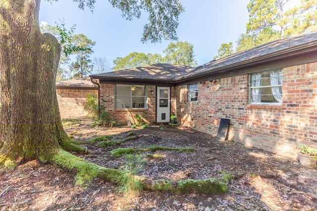 exterior space with brick siding