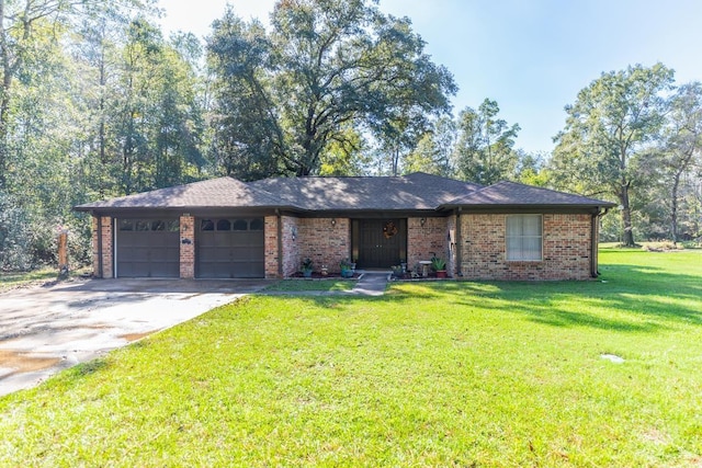 ranch-style home with brick siding, a garage, concrete driveway, and a front yard