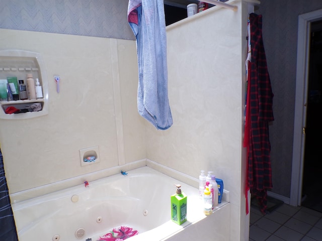 3100 Boyd Ave, Groves, TX 77619 - bathroom featuring a jetted tub and tile patterned flooring
