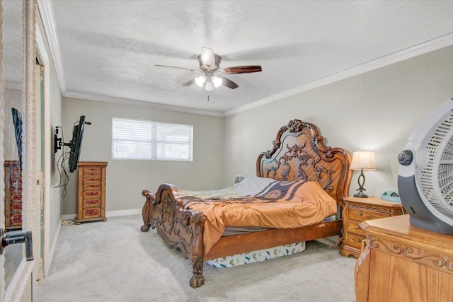 carpeted bedroom with a textured ceiling, ceiling fan, and crown molding