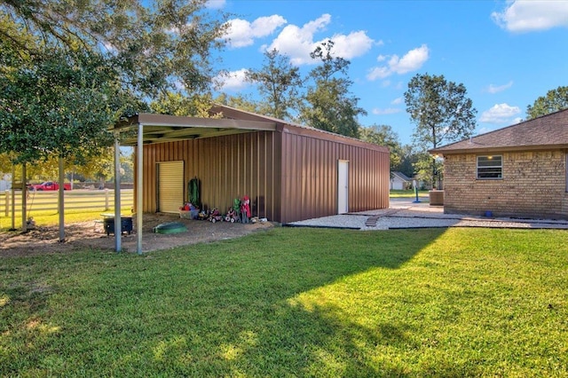 view of outbuilding featuring a yard