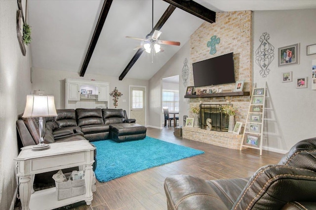 living room featuring ceiling fan, a brick fireplace, beamed ceiling, high vaulted ceiling, and hardwood / wood-style flooring