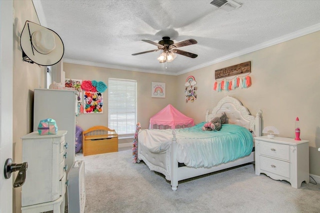 carpeted bedroom featuring ceiling fan, a textured ceiling, and ornamental molding