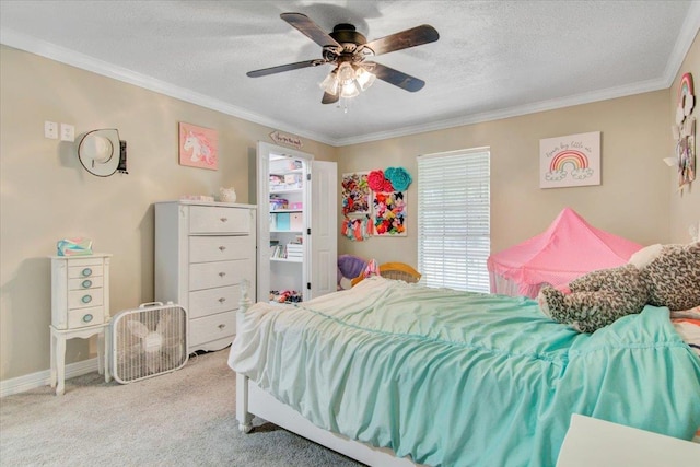 bedroom with ceiling fan, light carpet, a textured ceiling, and ornamental molding