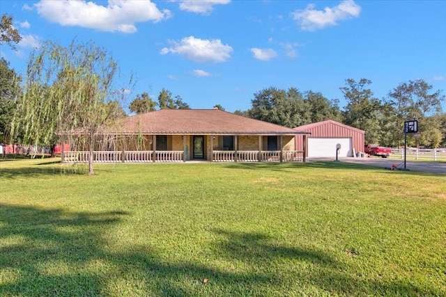 view of front of house featuring a porch, a garage, and a front yard