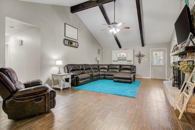 living room with vaulted ceiling with beams, ceiling fan, and hardwood / wood-style flooring