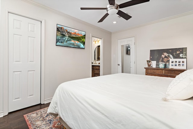 bedroom featuring ornamental molding, ensuite bathroom, ceiling fan, and dark hardwood / wood-style flooring