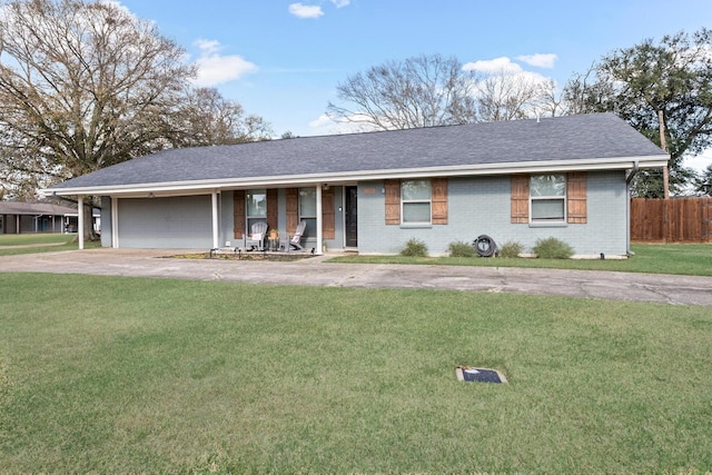 single story home with a front yard, a carport, and covered porch