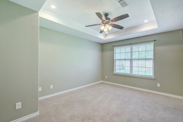 6640 Palace Dr, Lumberton, TX 77657 - carpeted empty room with visible vents, baseboards, a ceiling fan, and a raised ceiling