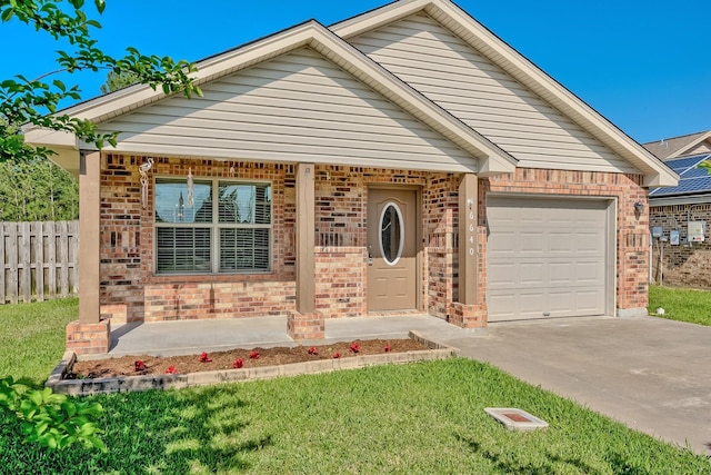 6640 Palace Dr, Lumberton, TX 77657 - single story home featuring an attached garage, fence, concrete driveway, brick siding, and a front lawn