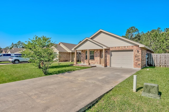 6640 Palace Dr, Lumberton, TX 77657 - ranch-style house with concrete driveway, an attached garage, a front yard, brick siding, and fence