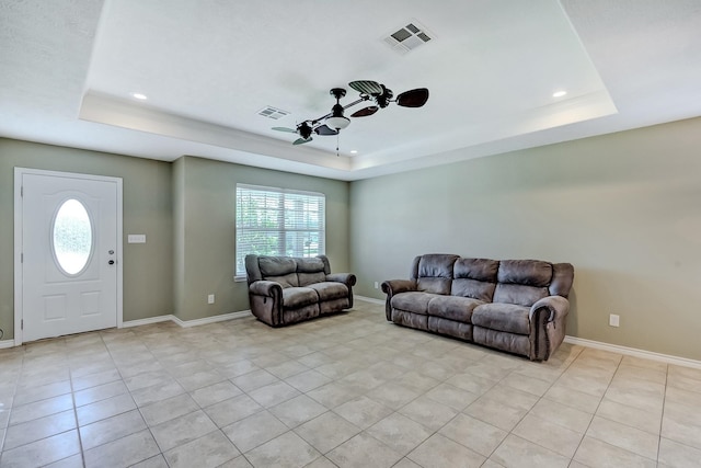 6640 Palace Dr, Lumberton, TX 77657 - living area featuring a tray ceiling, a ceiling fan, plenty of natural light, and visible vents