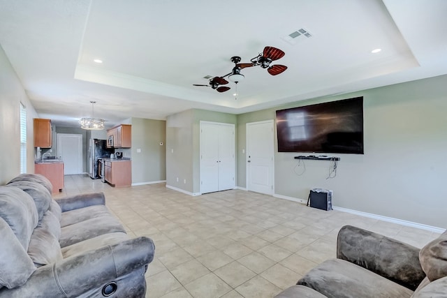 6640 Palace Dr, Lumberton, TX 77657 - living room with a raised ceiling, light tile patterned flooring, visible vents, and recessed lighting