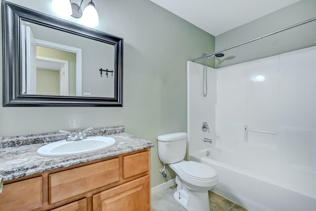 6640 Palace Dr, Lumberton, TX 77657 - bathroom with baseboards, toilet, vanity, tile patterned flooring, and bathing tub / shower combination