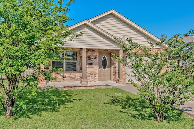 6640 Palace Dr, Lumberton, TX 77657 - view of front of house featuring a front yard and brick siding