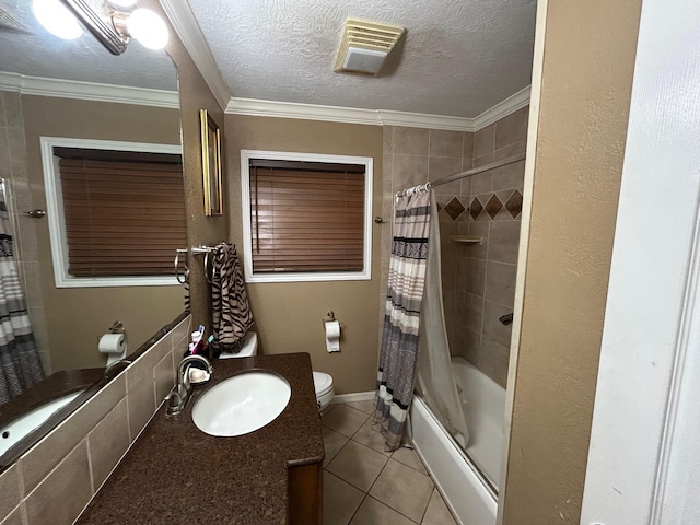 1009 Arthur St, Bridge City, TX 77611 - full bathroom with toilet, vanity, tile patterned floors, shower / bathtub combination with curtain, and a textured ceiling