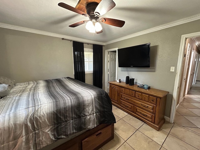 1009 Arthur St, Bridge City, TX 77611 - bedroom with light tile patterned floors, ornamental molding, ceiling fan, and baseboards