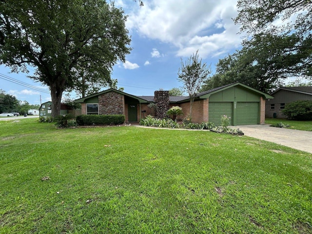1009 Arthur St, Bridge City, TX 77611 - mid-century inspired home with a garage, a chimney, a front yard, driveway, and stone siding