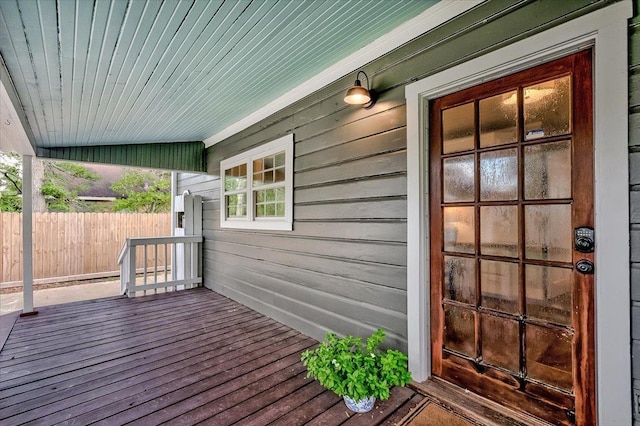 wooden terrace featuring covered porch