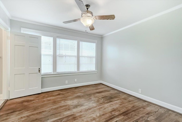 empty room featuring hardwood / wood-style flooring, ceiling fan, and crown molding