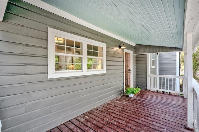 wooden terrace with a porch