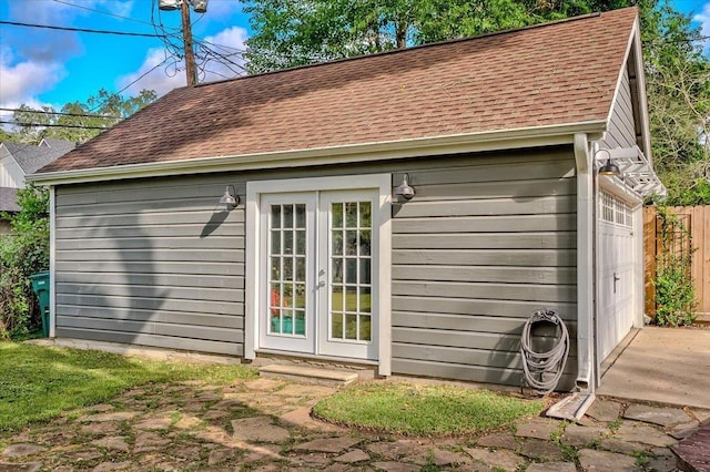 view of outdoor structure featuring french doors and a garage