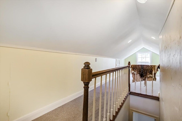 staircase with carpet flooring and vaulted ceiling