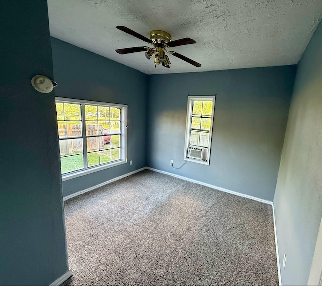 1235 13th St, Street, Port Arthur, TX 77640 - carpeted empty room with baseboards, ceiling fan, and a textured ceiling