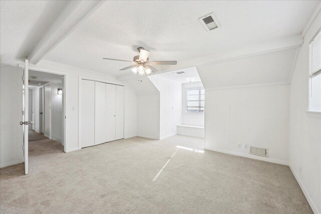 345 Mayhaw Dr, Vidor, TX 77662 - additional living space featuring lofted ceiling with beams, a textured ceiling, visible vents, and a ceiling fan