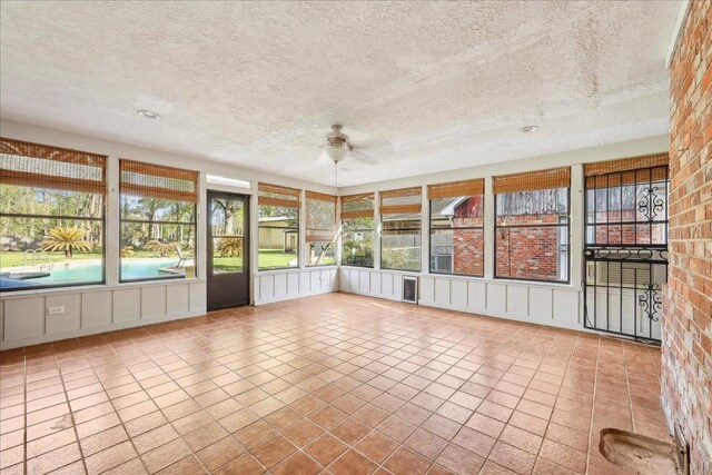 345 Mayhaw Dr, Vidor, TX 77662 - unfurnished sunroom with a ceiling fan
