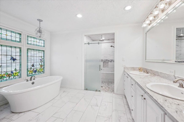 345 Mayhaw Dr, Vidor, TX 77662 - bathroom with a shower stall, marble finish floor, a sink, and a textured ceiling
