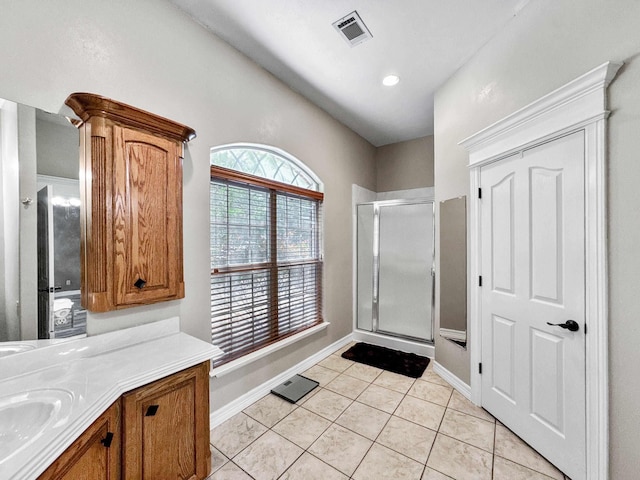 2460 W Norman Cir, Orange, TX 77630 - full bath featuring a shower stall, tile patterned floors, vanity, baseboards, and recessed lighting