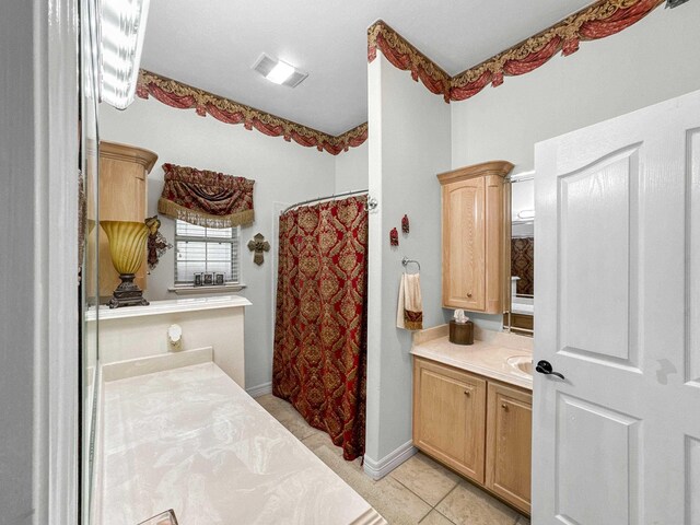 2460 W Norman Cir, Orange, TX 77630 - full bathroom featuring vanity, tile patterned flooring, and a shower with curtain