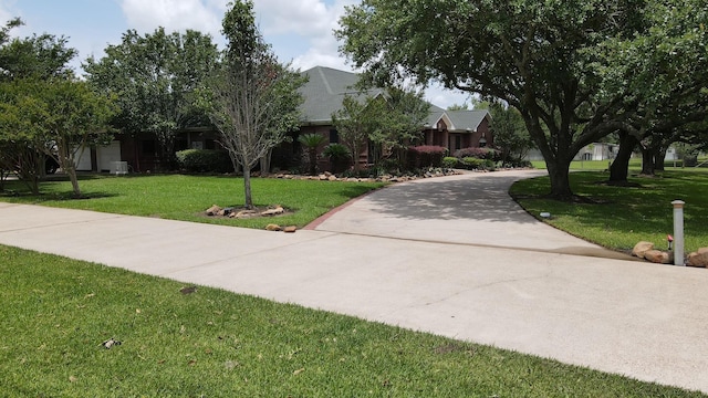 2460 W Norman Cir, Orange, TX 77630 - view of front facade with a front lawn