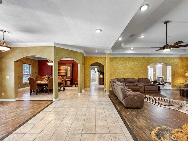 2460 W Norman Cir, Orange, TX 77630 - living area featuring ornamental molding, arched walkways, a ceiling fan, baseboards, and recessed lighting