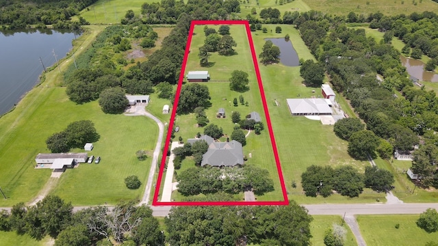 2460 W Norman Cir, Orange, TX 77630 - aerial overview of property's location featuring a large body of water and property parcel outlined