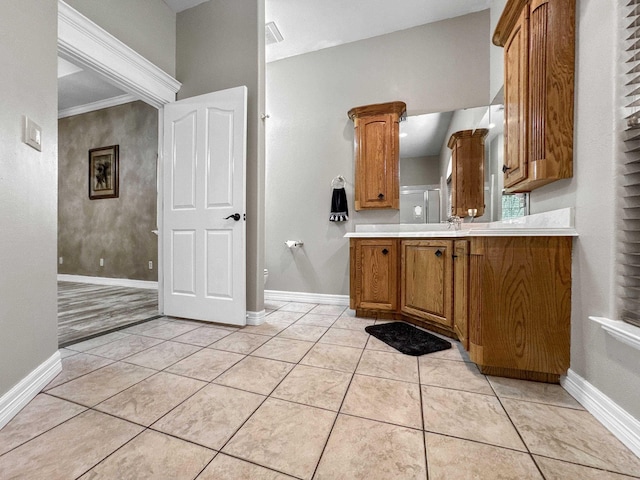 2460 W Norman Cir, Orange, TX 77630 - bathroom featuring vanity, toilet, baseboards, and tile patterned flooring