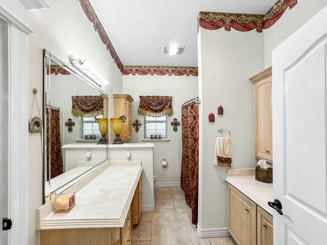 2460 W Norman Cir, Orange, TX 77630 - bathroom featuring vanity, toilet, tile patterned flooring, and a shower with curtain