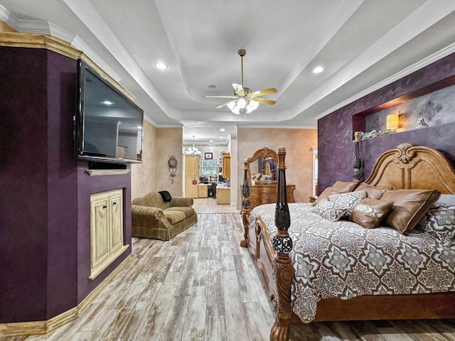 2460 W Norman Cir, Orange, TX 77630 - bedroom with a raised ceiling, wood finished floors, recessed lighting, crown molding, and a ceiling fan