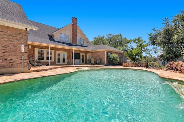7230 W Fm 1004, Buna, TX 77612 - view of pool featuring french doors, a patio, and a hot tub