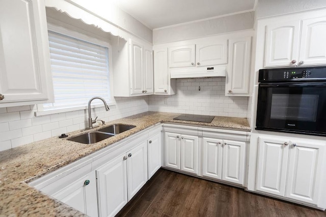 kitchen featuring sink, dark wood-type flooring, white cabinets, light stone counters, and black appliances