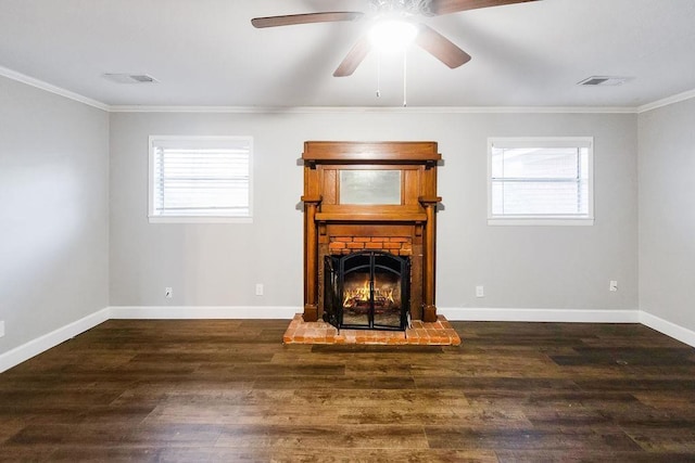 unfurnished living room with crown molding, ceiling fan, a brick fireplace, and dark hardwood / wood-style flooring