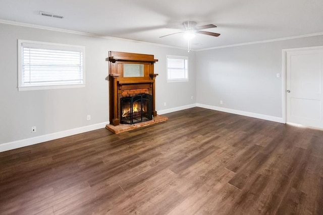 unfurnished living room featuring crown molding, dark wood-type flooring, and ceiling fan